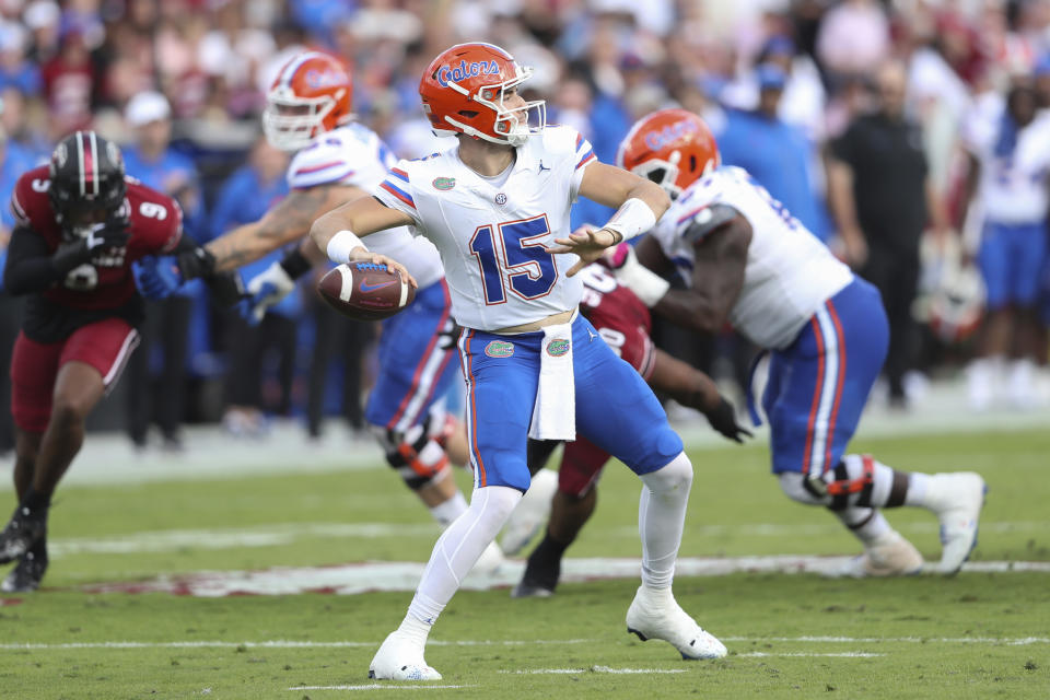 Florida quarterback Graham Mertz (15) drops back to pass during the first half of an NCAA college football game against South Carolina on Saturday, Oct. 14, 2023, in Columbia, S.C. (AP Photo/Artie Walker Jr.)