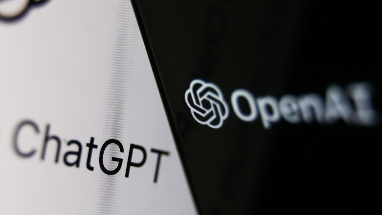  OpenAI logo displayed on a phone screen and ChatGPT website displayed on a laptop screen are seen in this illustration photo taken in Krakow, Poland on December 5, 2022. . 