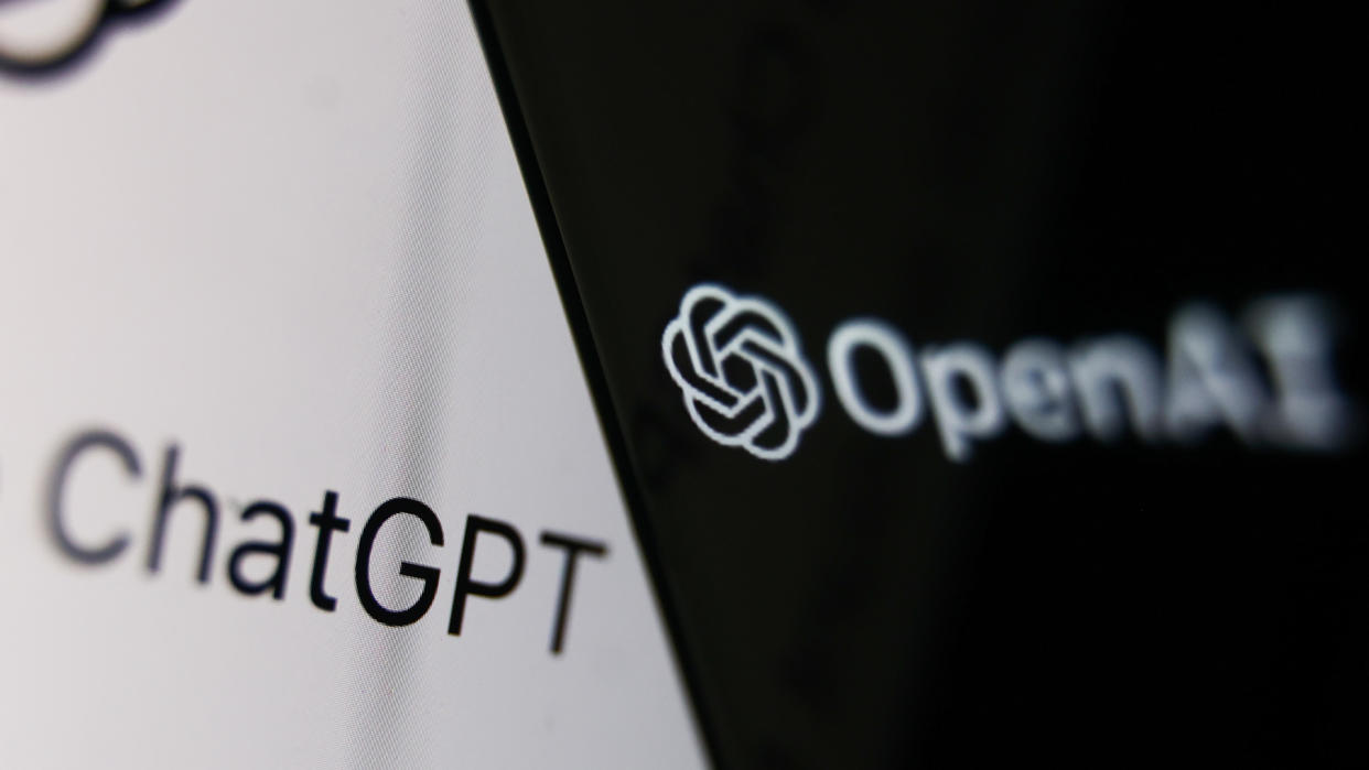  OpenAI logo displayed on a phone screen and ChatGPT website displayed on a laptop screen are seen in this illustration photo taken in Krakow, Poland on December 5, 2022.  