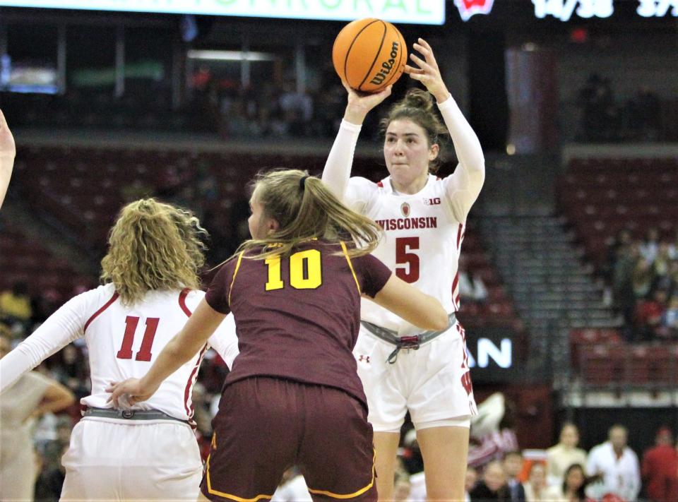 Wisconsin's Julie Pospisilova pulled up for three of her 20 points during the Badgers' 81-77 victory over Minnesota at the Kohl Center in Madison, Wis. on Sunday Jan. 8, 2023.