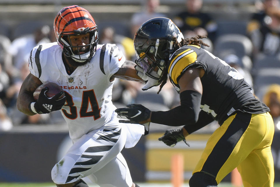 Cincinnati Bengals running back Samaje Perine (34) tries to evade Pittsburgh Steelers strong safety Terrell Edmunds (34) during the second half an NFL football game, Sunday, Sept. 26, 2021, in Pittsburgh. (AP Photo/Don Wright)