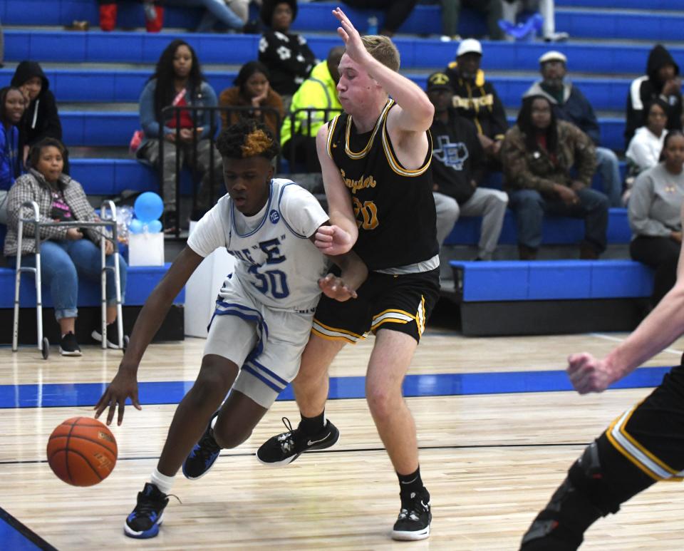 Estacado's Moses Stephenson dribbles the ball against Snyder in a District 5-4A basketball game Tuesday, Feb. 7, 2023, at Estacado High School.