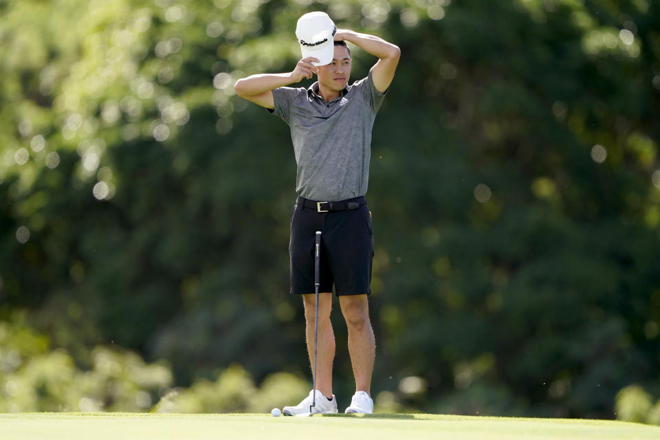 Collin Morikawa waits to putt on the 18th green during a practice round prior to the Tournament of Champions golf event, Wednesday, Jan. 6, 2021, at Kapalua Plantation Course in Kapalua, Hawaii. (AP Photo/Matt York)