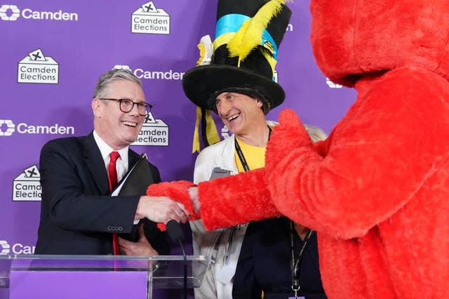 Labour leader Sir Keir Starmer shakes hands with Nick the Incredible Flying Brick and Bobby 'Elmo' Smith 