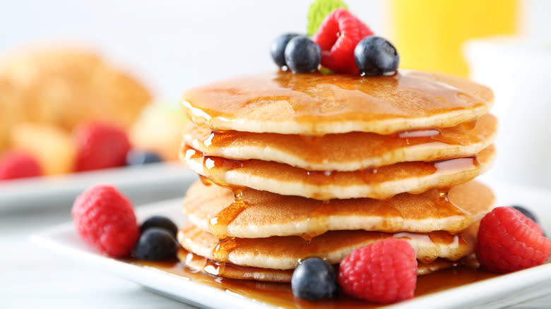 Pancakes with berries and syrup