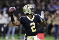 New Orleans Saints quarterback Jameis Winston (2) throws a pass during the first half of a preseason NFL football game against the Los Angeles Chargers in New Orleans, Friday, Aug. 26, 2022. (AP Photo/Butch Dill)