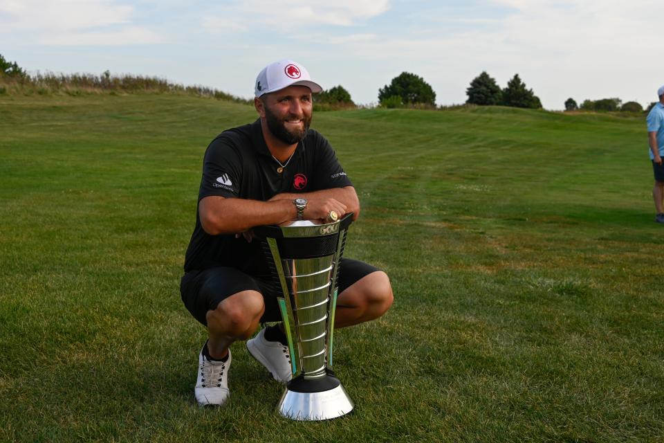 Sep 15, 2024; Bolingbrook, Illinois, USA; Jon Rahm of the Legion XIII holds the individual trophy after winning the LIV Golf Chicago tournament at Bolingbrook Golf Club. Mandatory Credit: Matt Marton-Imagn Images