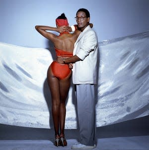 American fashion designer Willi Smith poses with his sister, fashion model Toukie Smith (born Doris Smith), New York, New York, 1980s.