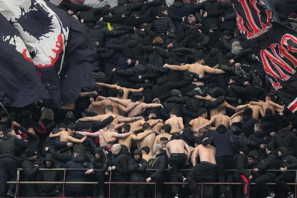 AC Milan's supporters stand during a Serie A soccer match between AC Milan and Empoli at the San Siro stadium in Milan, Italy, Sunday, March 10, 2024. (AP Photo/Luca Bruno)