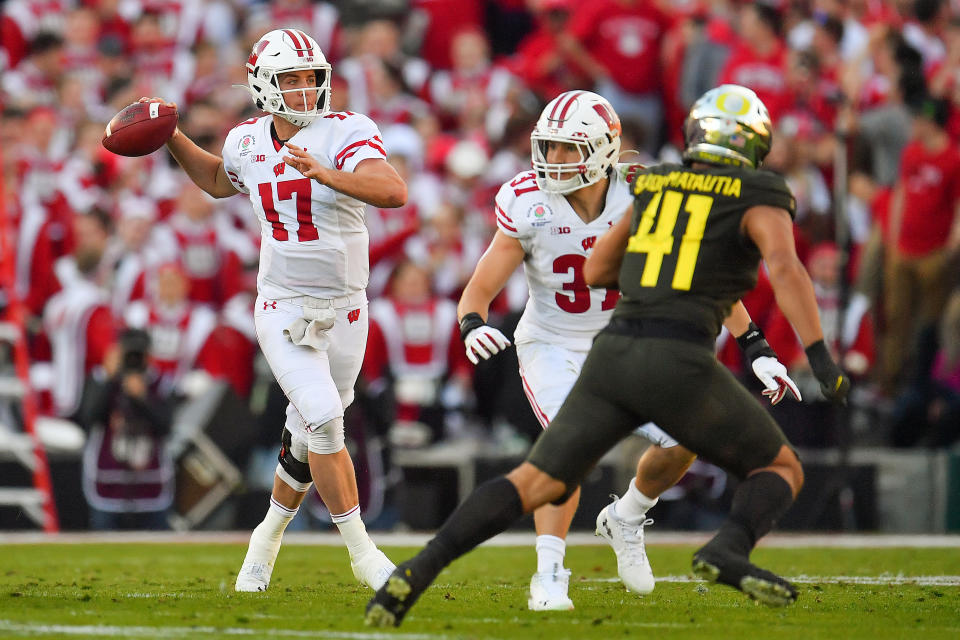 PASADENA, CALIFORNIA - JANUARY 01: Jack Coan #17 of the Wisconsin Badgers throws the ball during the second quarter of the game against the Oregon Ducks at the Rose Bowl on January 01, 2020 in Pasadena, California. The Oregon Ducks topped the Wisconsin Badgers, 28-27. (Photo by Alika Jenner/Getty Images)