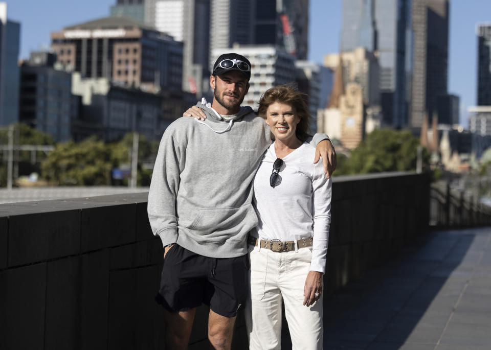 Tommy Paul, left, of the U.S. walks with his mother Jill along the Yarra River in Melbourne, Australia, Thursday, Jan 26, 2023. Paul will play Novak Djokovic of Serbia in a semifinal at a the Australian Open, here Friday, Jan. 27. (Fiona Hamilton/Tennis Australia via AP)