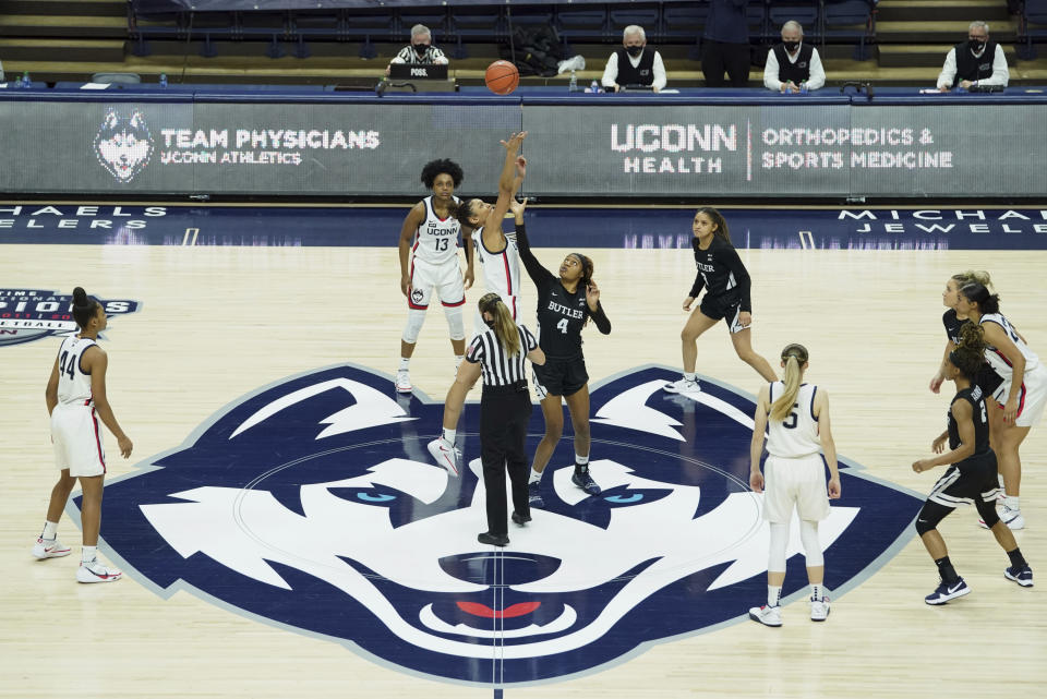 UConn tip-off against Butler to start an NCAA college basketball game Tuesday, Jan. 19, 2021, in Storrs, Conn. (David Butler II/Pool Photo via AP)