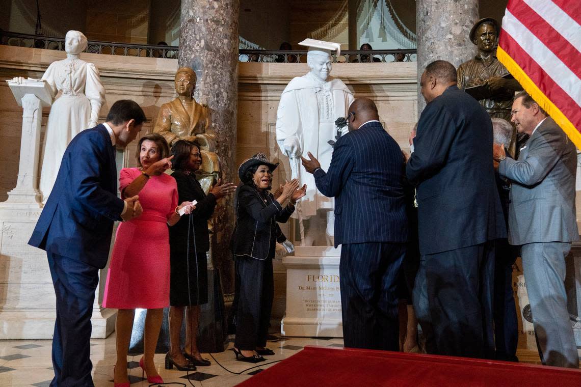 Speaker of the House Nancy Pelosi of Calif., second from left, gestures to Sen. Marco Rubio, D-Fla., as Rep. Val Demings, D-Orlando, and Rep. Frederica Wilson, D-Miami., center, react along with members of the Florida Congressional Delegation, during the unveiling of a state statue from Florida of Mary McLeod Bethune, in Statuary Hall, Wednesday, July 13, 2022, at the U.S. Capitol in Washington.