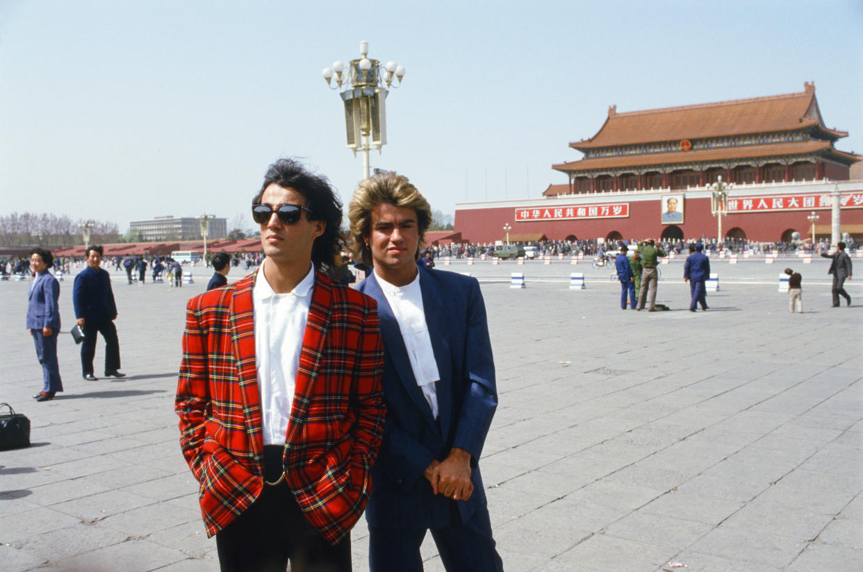 Wham!'s Andrew Ridgeley and George Michael during their 10-day visit to China in April 1985, pictured in front of the Forbidden Palace in Tiananmen Square, Peking. (Kent Gavin/Mirrorpix/Getty Images)