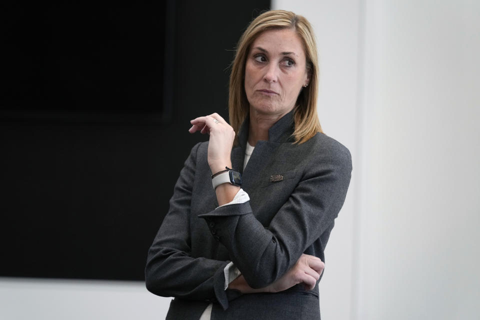 Iowa interim athletic director Beth Goetz listens to Iowa head coach Kirk Ferentz speak during a news conference, Tuesday, Oct. 31, 2023, in Iowa City, Iowa. Goetz announced on Monday that Ferentz's son, Brian, would not return as offensive coordinator next year. (AP Photo/Charlie Neibergall)