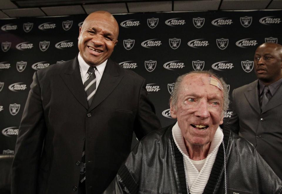 Former Oakland Raiders owner Al Davis hired Hue Jackson (L) to be his head coach in 2011, the year Davis eventually died. (AP)