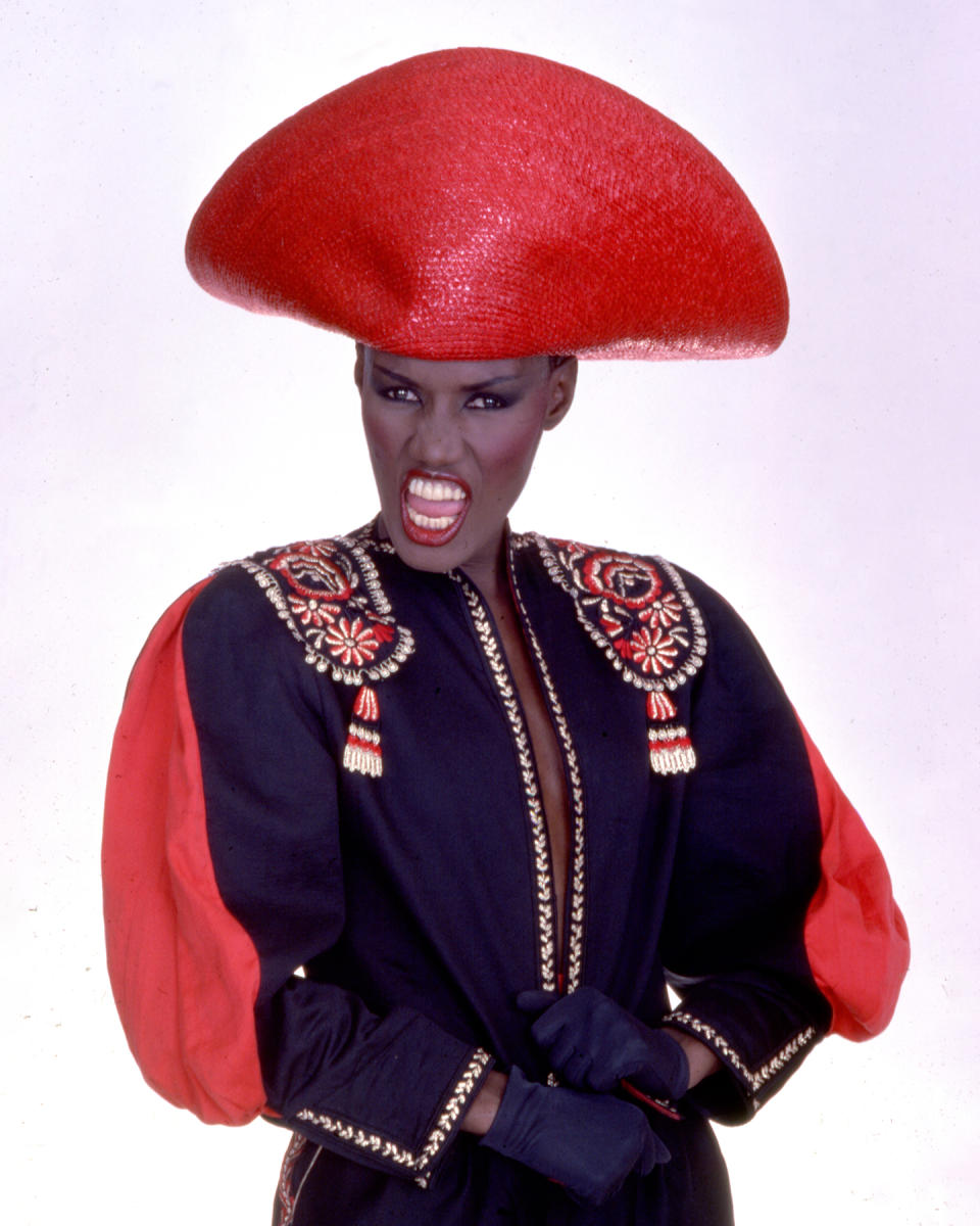 Portrait of Jamaican-born model, singer, and actress Grace Jones as she wears a bright red hat and multi-colored top, New York, New York, late twentieth century. (Photo by Anthony Barboza/Getty Images)