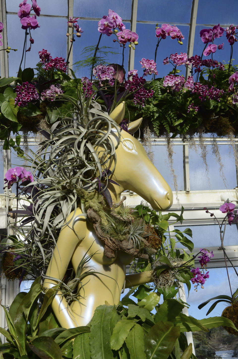 A fashion-creation inspired by nature from Collina Strada designed by Hillary Taymour in "The Orchid Show: Florals in Fashion" at The New York Botanical Garden, Saturday, Feb. 17, 2024, in the Bronx borough of New York. The show runs until April 21, 2024. (AP Photo/Pamela Hassell)