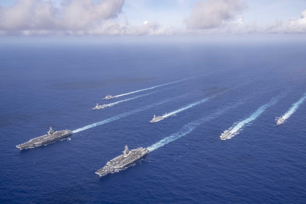 PHILIPPINE SEA (June 23, 2020). The Theodore Roosevelt Carrier Strike Group transits in formation with the Nimitz Carrier Strike Group while conducting dual carrier and airwing operations in the Philippine Sea June 23, 2020. Dual carrier operations unify the tactical power of two individual carrier strike groups, providing fleet commanders with an unmatched, unified credible combat force capable of operating indefinitely. The Nimitz and Theodore Roosevelt carrier strike groups are on scheduled deployments to the Indo-Pacific. (Photo: Mass Communication Specialist Seaman Dylan Lavin/U.S. 7th Fleet)