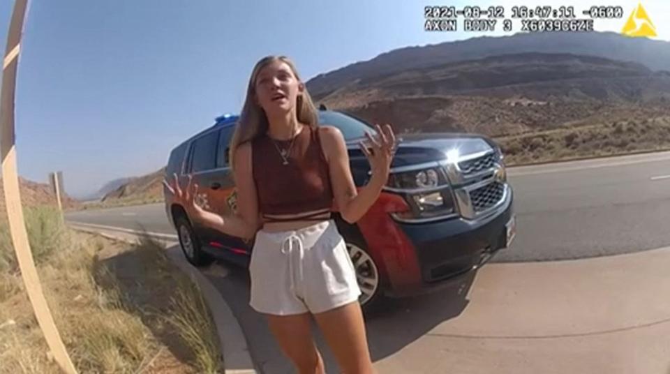 In this file August 12, 2021, still image from a police bodycam released by the Moab City Police Department in Utah, Gabrielle Petito speaks with police as they responded to an altercation between Petito and her boyfriend, Brian Laundrie.