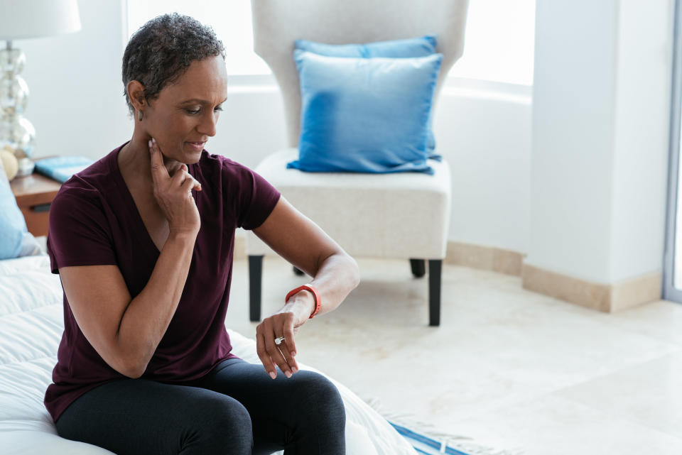 A woman checking her pulse