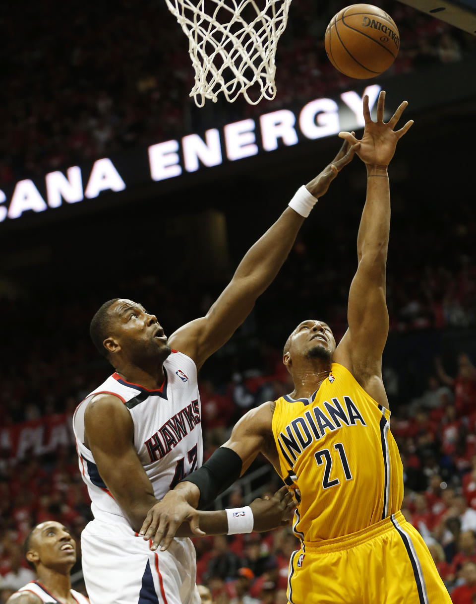 Indiana Pacers forward David West (21) shoots as Atlanta Hawks forward Elton Brand (42) defends in the first half of Game 6 of a first-round NBA basketball playoff series in Atlanta, Thursday, May 1, 2014. (AP Photo/John Bazemore)