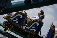 Alessandro Zamperla, president & CEO of Central Amusement International, above, rides "Tony's Express," named after his grandfather Antonio, at his company's construction site in the amusement park district of Coney Island, Friday, June 17, 2022, in the Brooklyn borough of New York. Luna Park in Coney Island will open three new major attractions this season alongside new recreational areas and pedestrian plazas. (AP Photo/John Minchillo)