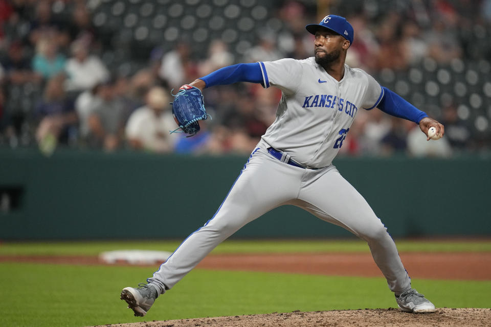 Kansas City Royals' Amir Garrett (22) pitches to a Cleveland Guardians batter during the sixth inning of a baseball game Thursday, July 6, 2023, in Cleveland. (AP Photo/Sue Ogrocki)