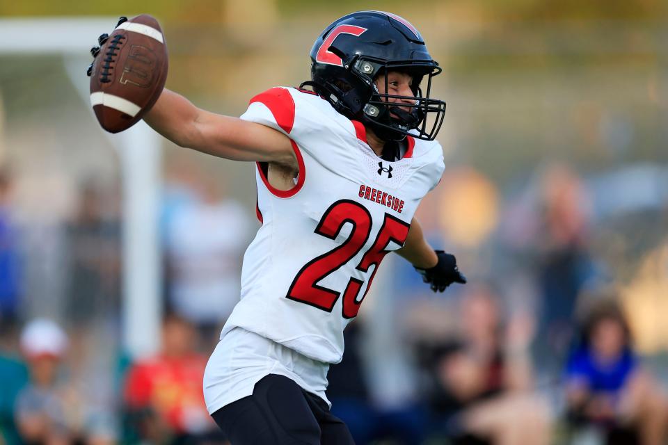 Creekside's Cooper Dixon (25) breaks away for a receiving touchdown in August. The Knights are among several St. Johns County teams that will be watching for results outside the area in the at-large football playoff race.