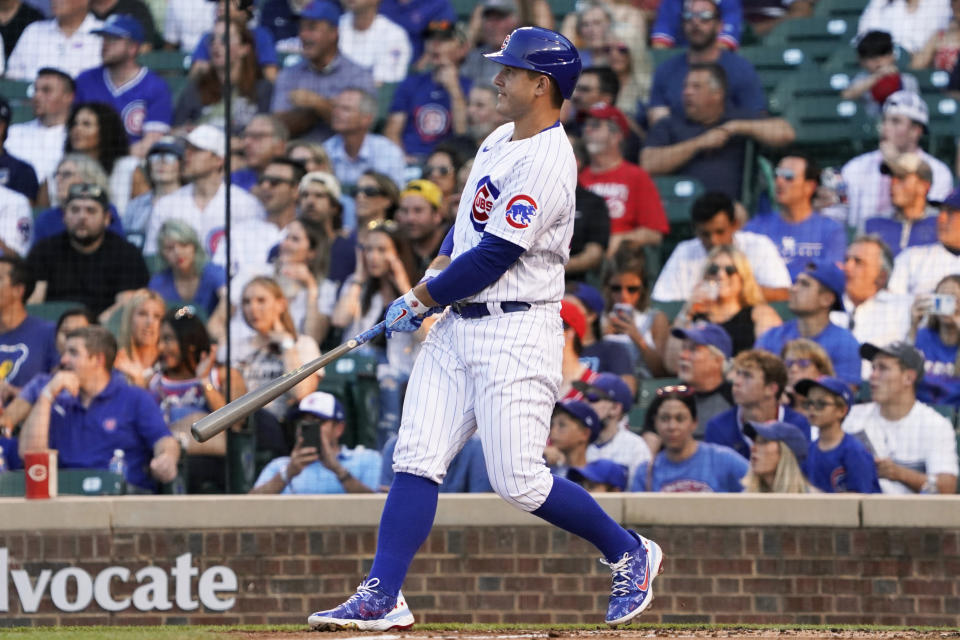 Chicago Cubs' Anthony Rizzo watches his two-run home run against the Cincinnati Reds during the first inning of a baseball game Tuesday, July 27, 2021, in Chicago. (AP Photo/David Banks)