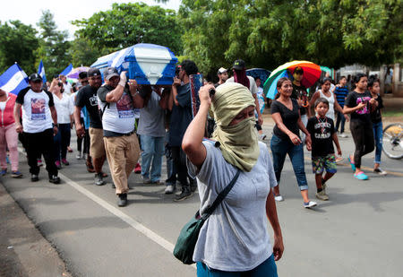 Demonstrators take part in funeral service of Agustin Ezequiel Mendoza, who was shot in recent protests against Nicaraguan President Daniel Ortega's government in Tipitapa, Nicaragua June 15, 2018. REUTERS/Oswaldo Rivas