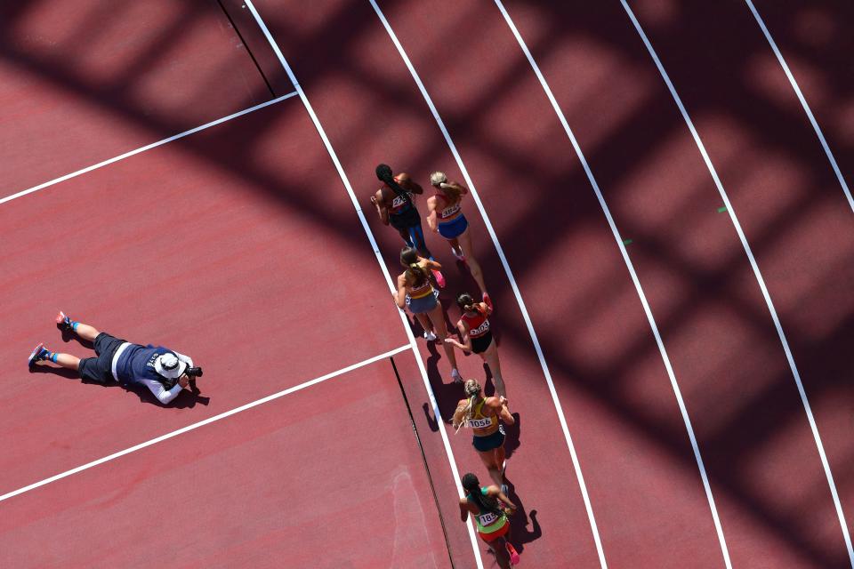 <p>Athletes compete in the women's 3000m steeplechase heats during the Tokyo 2020 Olympic Games at the Olympic Stadium in Tokyo on August 1, 2021. (Photo by Antonin THUILLIER / AFP)</p> 