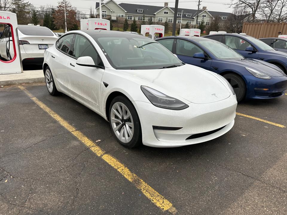 Tesla Model 3 at a charger