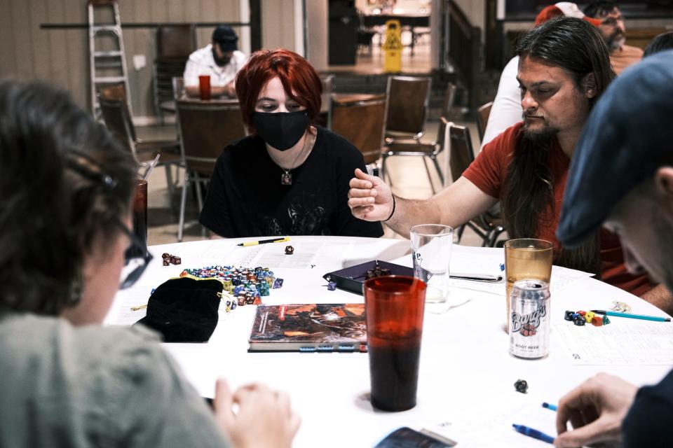 Players engage in Dungeons & Dragons at VFW Post 660. The crowd is a mix of veterans, SCAD students and other fans of D&D.