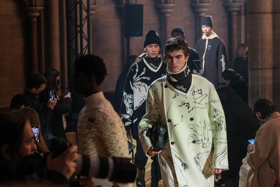 Models wear creations for the Jil Sander fall-winter 22/23 men's collection, in Paris, Friday, Jan. 21, 2022. (AP Photo/Michel Euler)