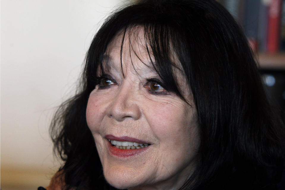 FILE - In this Thursday, April 12, 2012 file photo, French actress and singer Juliette Greco attends a ceremony to receive the Vermeil Medal of Paris from Paris Mayor Bertrand Delanoe at City Hall in Paris. French media say Juliette Greco, singer, actress, cultural icon and muse to Existentialist philosophers of France’s post-War period, has died aged 93. They said Wednesday, Sept. 23, 2020 Greco died in her Ramatouelle house in the south of France, near Saint Tropez. (AP Photo/Francois Mori, file)