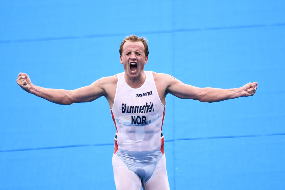 <p>Norway's Kristian Blummenfelt celebrates finishing first in the men's individual triathlon competition during the Tokyo 2020 Olympic Games at the Odaiba Marine Park in Tokyo on July 26, 2021. (Photo by Loic VENANCE / AFP)</p> 