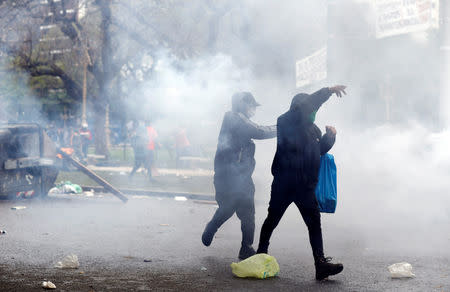 A protester hurls stones at the police during clashes outside the Congress, where the budget bill is being debated, in Buenos Aires, Argentina October 24, 2018. REUTERS/Martin Acosta