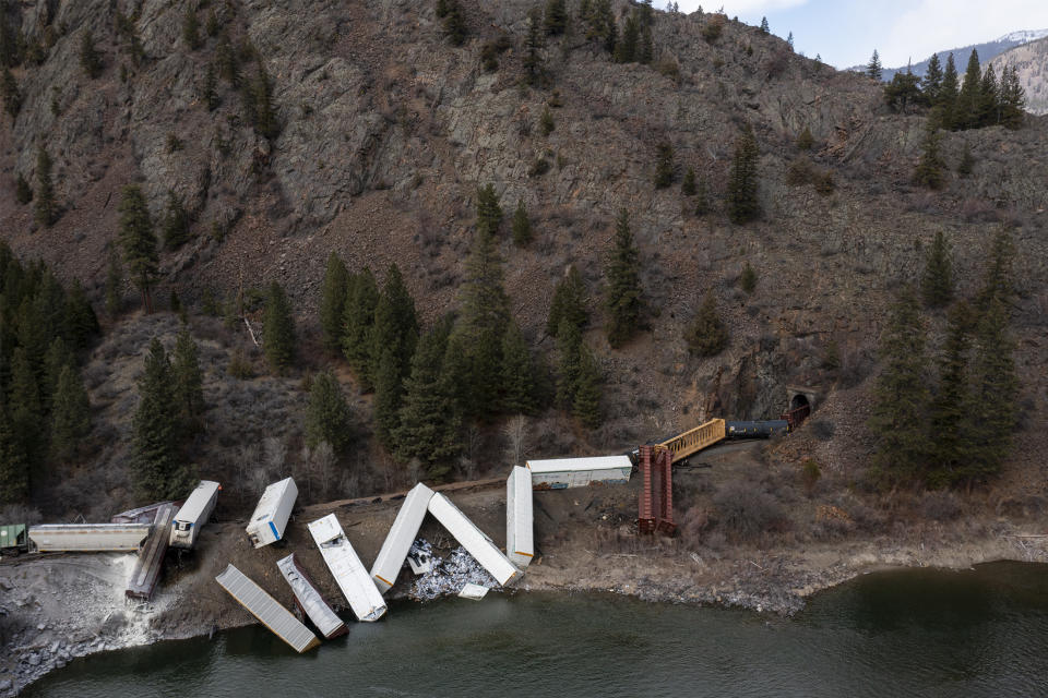 A train sits derailed near Quinn's Hot Springs Resort west of St. Regis, Mont., Sunday, April 2, 2023. Montana Rail Link is investigating the derailment in which there were no injuries reported. (Ben Allan Smith/The Missoulian via AP)