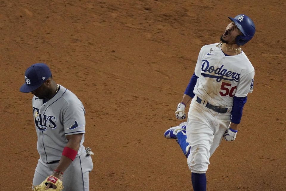 Los Angeles Dodgers' Mookie Betts celebrates after a home run against the Tampa Bay Rays during the eighth inning in Game 6 of the baseball World Series Tuesday, Oct. 27, 2020, in Arlington, Texas. (AP Photo/Sue Ogrocki)