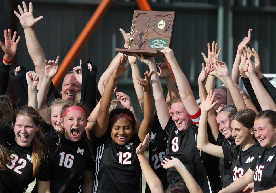 The Manchester girls soccer team celebrates after beating Poland Seminary, 1-0, in a Division III regional championship soccer game at Howland High School, Saturday, Nov. 5, 2022, in Howland, Ohio.