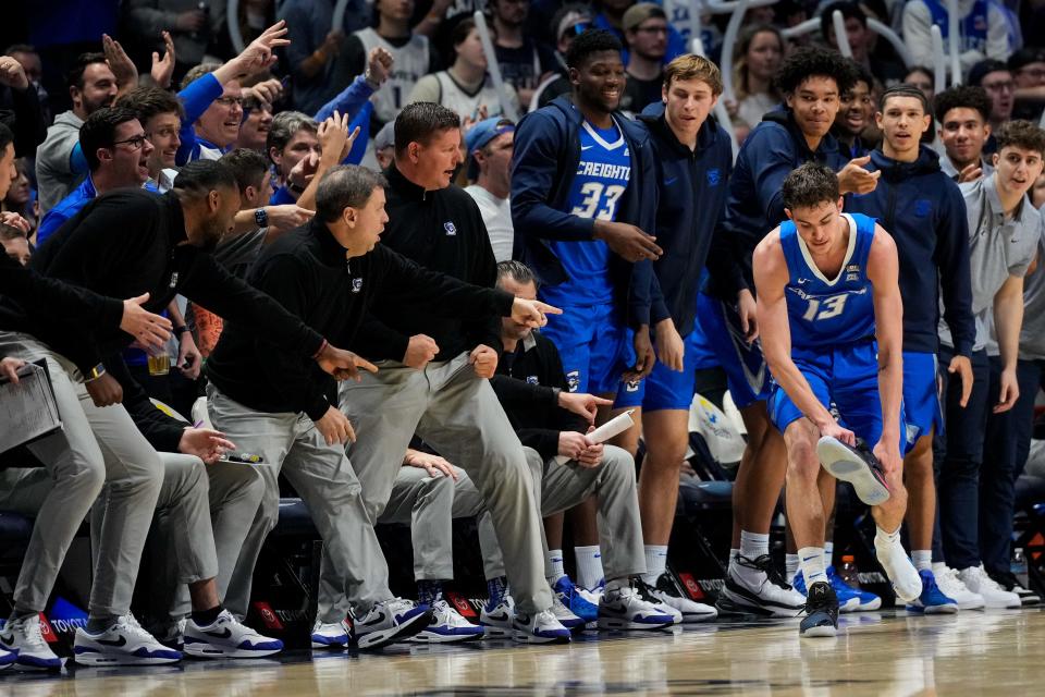 Creighton Bluejays forward Mason Miller (13) loses his shoe after shooting a three point basket in the second half of the NCAA Big East Conference basketball game between the Xavier Musketeers and the Creighton Bluejays at the Cintas Center in Cincinnati on Saturday, Feb. 10, 2024. Creighton took the conference match, 78-71.