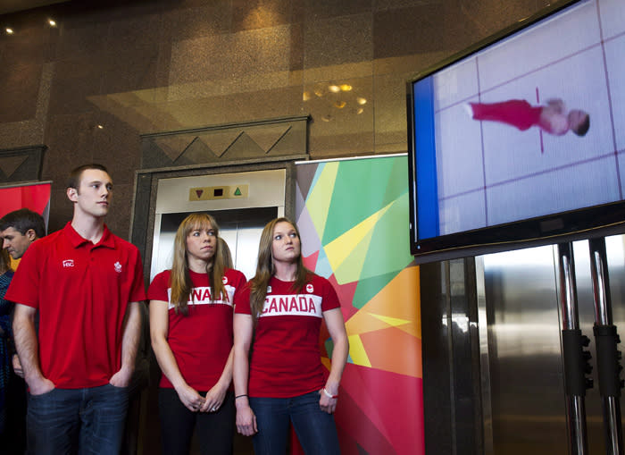 Canadian Olympic trampoline athletes Jason Burnett, left, Karen Cockburn, centre, and Rosie MacLennan, right