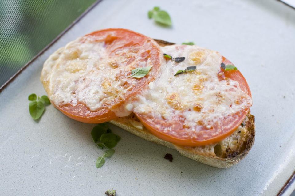 This July 15, 2013 photo shows toasted Parmesan tomato bread in Concord, N.H. (AP Photo/Matthew Mead)