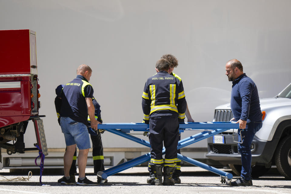 Italian Carabinieri police officers arrive at Canazei, in the Italian Alps in northern Italy, Wednesday, July 6, 2022, to investigate over an avalanche that broke loose on Sunday from the Punta Rocca glacier sending tons of ice, snow, and rocks onto hikers. (AP Photo/Luca Bruno)