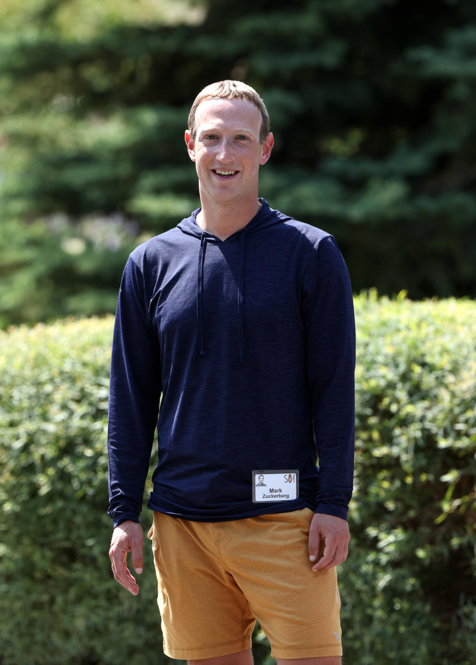 him standing outside wearing a name tag