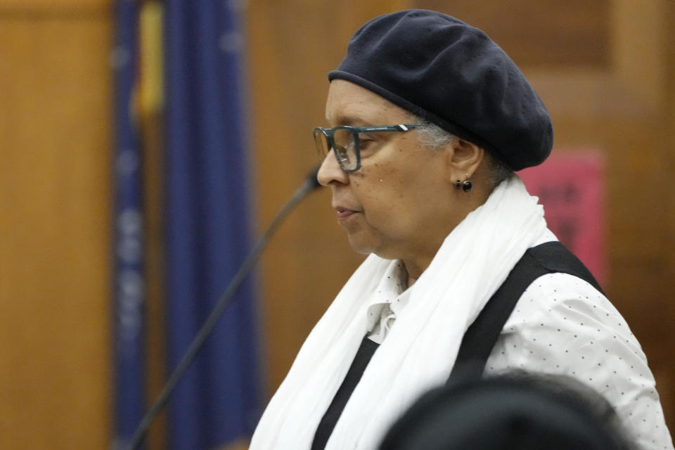 Ann Saunders, a Jackson resident approaches the witness stand to testify during a hearing, Wednesday, May 10, 2023, in Hinds County Chancery Court in Jackson, Miss., where a judge heard arguments about a Mississippi law that would create a court system with judges who would be appointed rather than elected. (AP Photo/Rogelio V. Solis)