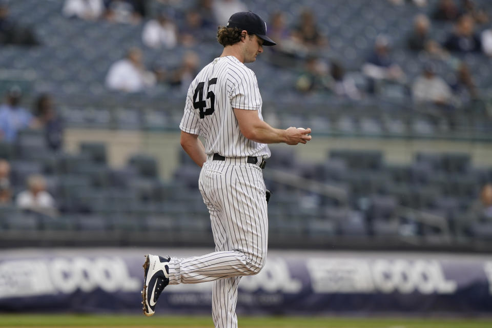 New York Yankees starting pitcher Gerrit Cole (45) reacts after allowing a two-run home run to Tampa Bay Rays designated hitter Austin Meadows during the fourth inning of a baseball game, Thursday, June 3, 2021, at Yankee Stadium in New York. (AP Photo/Kathy Willens)