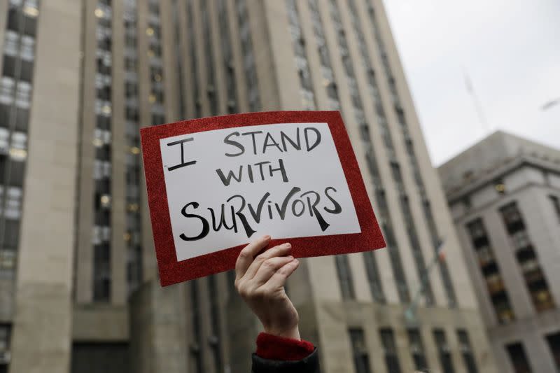 Sign is held on the first day of film producer Harvey Weinstein's sexual assault trial in New York City