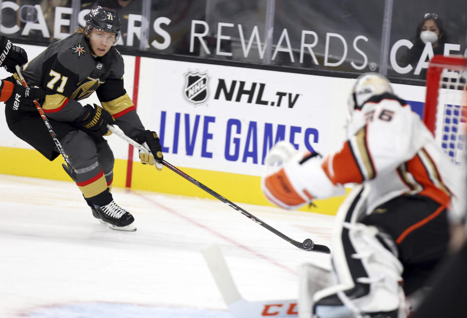 Vegas Golden Knights center William Karlsson (71) moves in on Anaheim Ducks goalie John Gibson (36) during the second period of an NHL hockey game Thursday, Jan. 14, 2021, in Las Vegas. (AP Photo/Isaac Brekken)